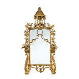 A Rococo revival gilt wood framed pier glass, carved in the Chinese Chippendale manner with pagoda