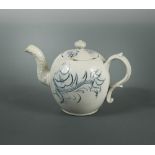 An 18th century Staffordshire salt-glazed miniature teapot and cover, the globular body decorated