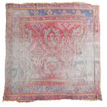 A faded Ushak rug, 331 x 292cm (129 x 114in)