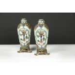 A pair of 19th Century gilt metal mounted famille verte type vases and covers, possibly Samson,