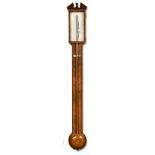 An early 19th century mahogany stick barometer, with broken pediment above rectangular silvered