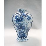 An 18th century Delft blue and white vase, of fluted shouldered ovoid form, decorated with a