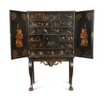 An 18th century Chinese lacquer cabinet on a later stand, fitted with twelve drawers and a small