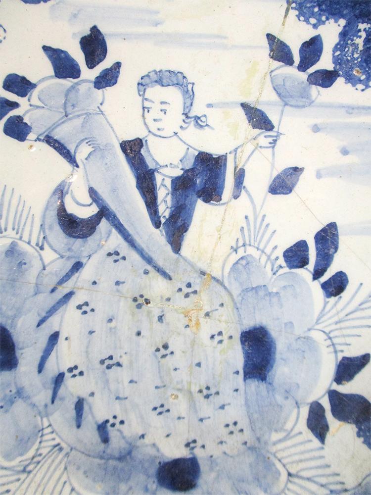 An 18th century Delft blue and white charger, decorated with a woman holding a cornucopia, 35cm - Image 4 of 13