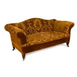 A 19th century Howard Style sofa, on four square mahogany and brass collar legs with brass casters
