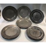 A set of four 18th century pewter plates with line banding the reverses, stamped Alex. Coulter, 24