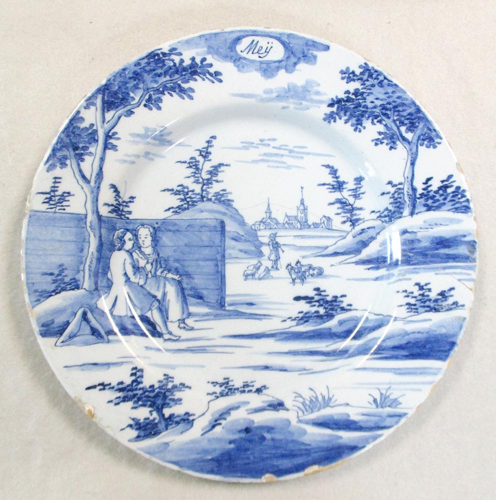 An 18th century Delft blue and white charger, decorated with a woman holding a cornucopia, 35cm - Image 7 of 13