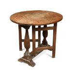 An 18th century oak oval drop leaf table, with alterations, on half -baluster end supports supports,