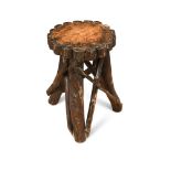 An early twentieth century rustic vernacular low table, of 'twig and branch' construction,