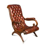 A Regency rosewood framed armchair, button upholstered in a patinated dark red leather, with