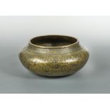 A good brass Fars bowl, Iran, probably 14th century, of swollen circular form with remains of silver