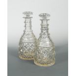 A pair of 19th century magnum decanters and stoppers, with prismatic triple necks and mushroom