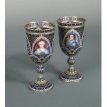 A pair of 20th century plique a jour and enamel goblets, probably Russian, each inset with an arched