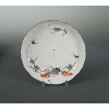 A Chantilly Kakiemon style porcelain shaped circular dish, circa 1735-40, decorated with the 'Flying