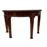 A Continental walnut demi-lune console table, with figured veneers to the frieze, on tapering square