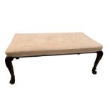 A mahogany framed upholstered stool, on leaf carved cabriole legs and claw feet, 51 x 128 x 64cm (20