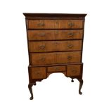 An 18th century walnut chest on stand, with pierced brass plate handles, on cabriole legs, 152.5 x