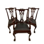 A set of six Edwardian mahogany 'Chippendale' style dining chairs, with leaf carved crest rails