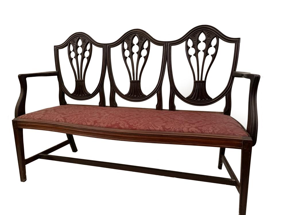 An Edwardian mahogany chair back settee in the Hepplewhite tradition, 97cm (38in) high x 141cm (55.