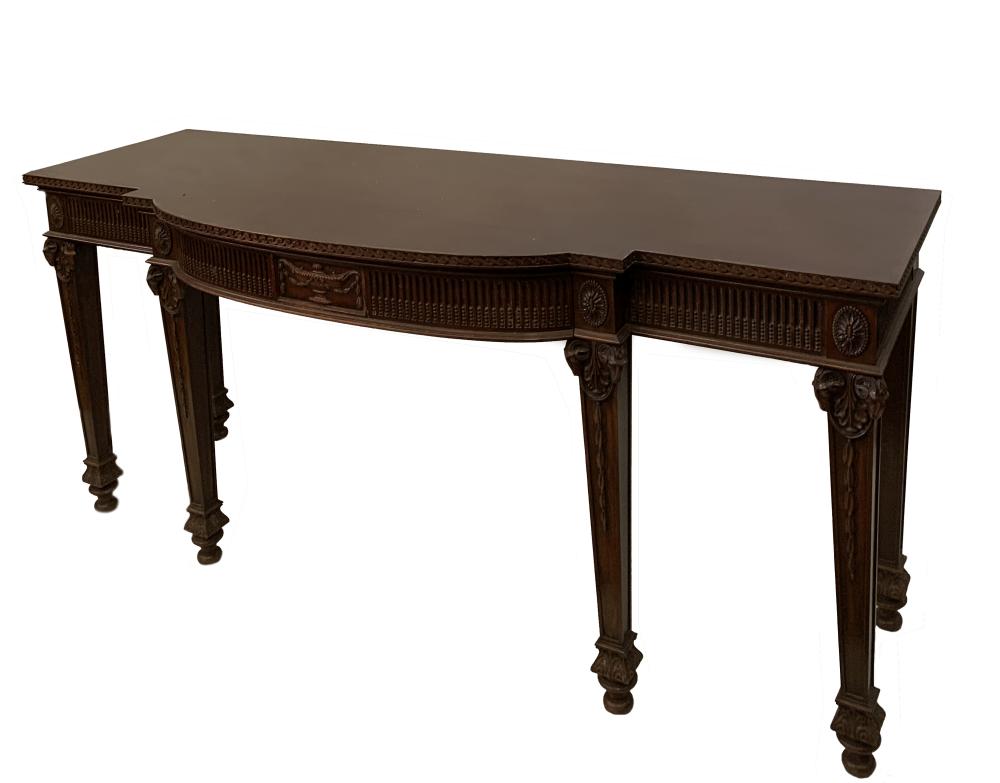 An Adam Revival mahogany breakfront serving table and matching pedestals, with Neoclassical Ram's