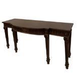 An Adam Revival mahogany breakfront serving table and matching pedestals, with Neoclassical Ram's