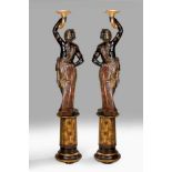 A pair of 19th century Venetian Blackamoor torcheres, the polychrome painted and gilded figures to