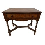 An 18th century and later walnut lowboy, fitted a single drawer, on twist carved column legs, united