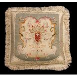 A pair of late 18th century Gobelin tapestry faced silk cushions, each with a central cartouche