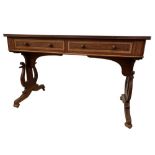 A Regency style mahogany sofa table, with two frieze drawers and dummy verso, on lyre shaped end
