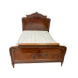 A late 19th century French mahogany and gilt mounted double bedstead, on turned and fluted legs,
