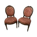 A pair of Continental parcel gilt parlour chairs with crestings, 93cm (36.5in) high x 49cm (19in)