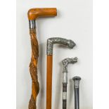 A late 19th century malacca walking cane with white metal handle, cast in relief with thistles,