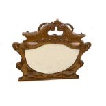 An Edwardian gilt framed overmantle mirror with break arch swan-neck cresting, and small vase