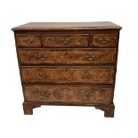An 18th century walnut chest of drawers, crossbanded and inlaid decoration, on bracket feet, 92cm (