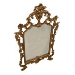 A George III style gilt composition framed mirror, 138 x 83cm (54 x 32.5in) wide