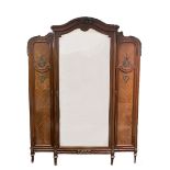 A late 19th century French mahogany breakfront armoire, with ormolu mounts on fluted and turned