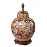 An early 20th century Imari jar and cover now as a table lamp, of globular form mounted to a
