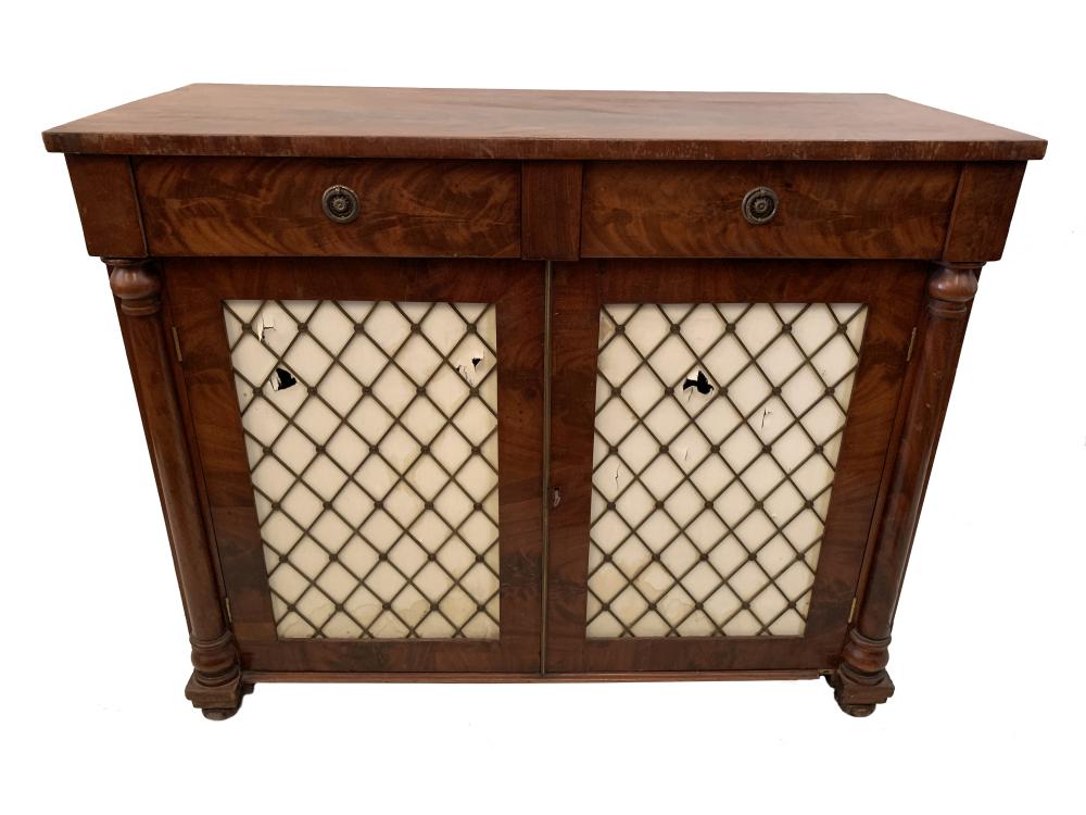 A Regency mahogany chiffonier with silk backed brass grill doors below two blind frieze drawers,