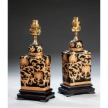 A pair of modern table lamps, the rectangular canister form bodies with gilt scroll decoration on