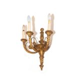 A set of four giltwood wall lights, each with three cornucopia moulded branches, 50cm (20in) high