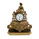 A 19th century gilt spelter cased mantle timepiece, on an associated giltwood stand, 33cm (13in)