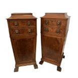 A pair of Regency mahogany pedestals, each with two drawers and cupboards, on lion paw feet (2)