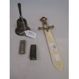 A silver table bell, 2 silver money clips and an ivory letter opener