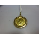 A simple rope edged pendant claw set with a George V half sovereign dated 1925 6.7g gross