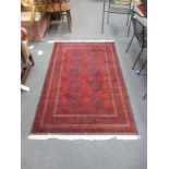 A small red Beluchi rug, 186 x 113cm