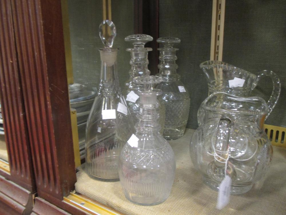 A pair of 19th century cut class decanters, of baluster form, the stoppers of segmented stoppers - Image 3 of 3