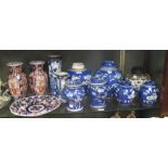 Three Chinese ginger jars and covers, a pair of Imari baluster vases, two cylindrical vases, a