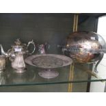 A large collection of silver plated ware including entree dishes, teapot, cocktail shaker, etc