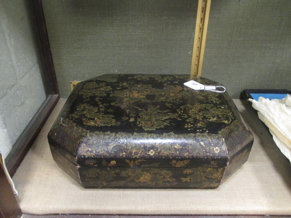 A Chinese export lacquered and gilt octagonal games box, 38cm wide, containing boxes and trays