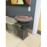 A pair of cast iron urns on stands a/f